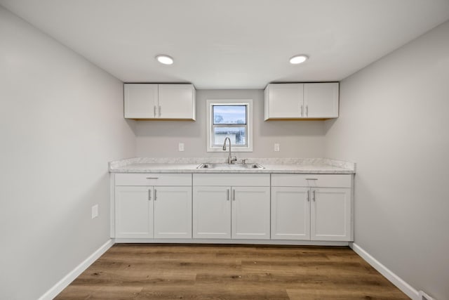 102 Hodges St N, Cowan, TN 37318 - kitchen with white cabinets, light countertops, wood finished floors, and recessed lighting