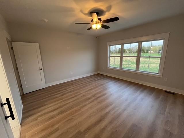 8246 Aedc Rd, Estill Springs, TN 37330 - unfurnished room with wood finished floors and ceiling fan