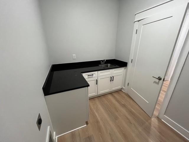 8246 Aedc Rd, Estill Springs, TN 37330 - washroom with a sink and light wood-style floors