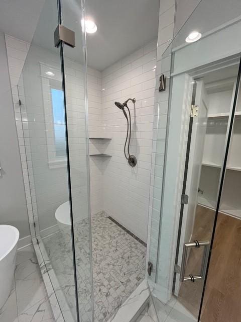 8246 Aedc Rd, Estill Springs, TN 37330 - bathroom with a stall shower, a freestanding bath, and marble finish floors