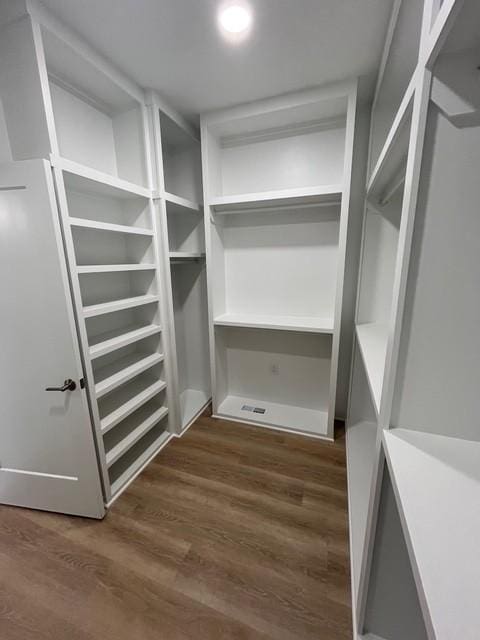 8246 Aedc Rd, Estill Springs, TN 37330 - spacious closet featuring dark wood-type flooring