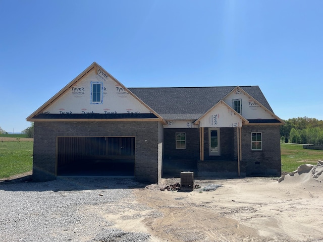 8246 Aedc Rd, Estill Springs, TN 37330 - property under construction featuring brick siding, a garage, and driveway