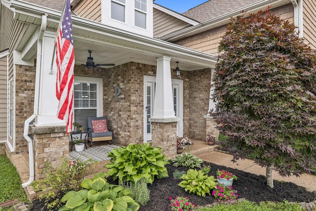 1443 Bern Dr, Spring Hill, TN 37174 - view of exterior entry featuring a ceiling fan, covered porch, brick siding, and a shingled roof