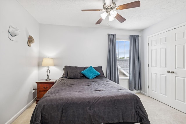 1443 Bern Dr, Spring Hill, TN 37174 - bedroom featuring light carpet, a textured ceiling, a closet, and a ceiling fan