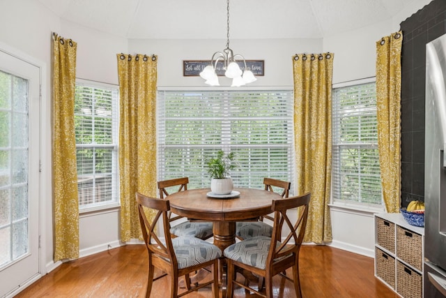 1443 Bern Dr, Spring Hill, TN 37174 - dining space featuring wood finished floors, a chandelier, and plenty of natural light