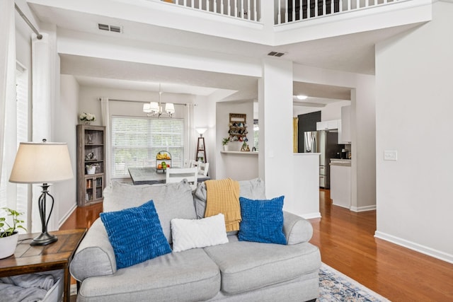 1443 Bern Dr, Spring Hill, TN 37174 - living area with a chandelier and wood finished floors