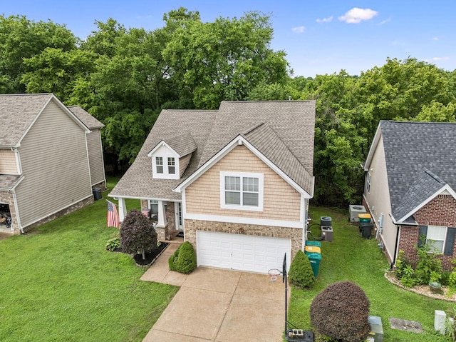 1443 Bern Dr, Spring Hill, TN 37174 - view of front of house with a garage, driveway, a front yard, and a shingled roof