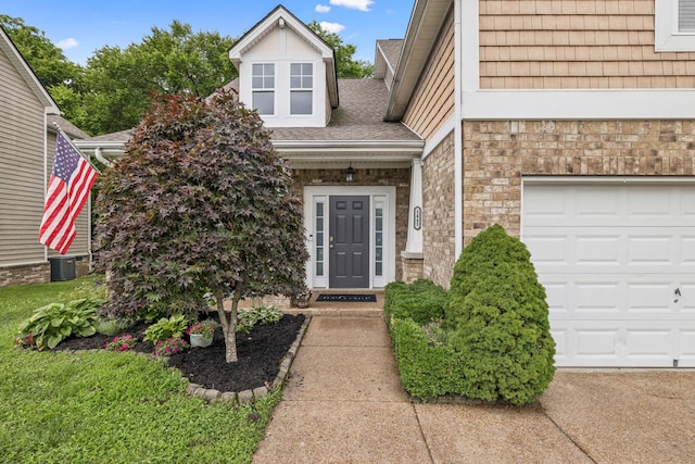 1443 Bern Dr, Spring Hill, TN 37174 - view of exterior entry featuring a garage and brick siding