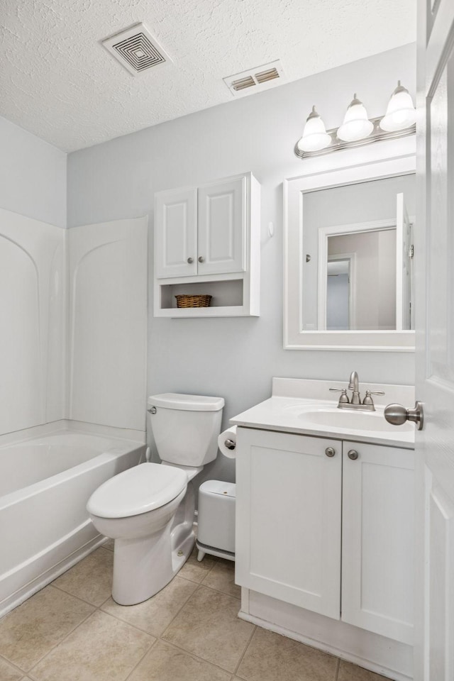 1443 Bern Dr, Spring Hill, TN 37174 - bathroom featuring vanity, a textured ceiling, tile patterned floors, and tub / shower combination