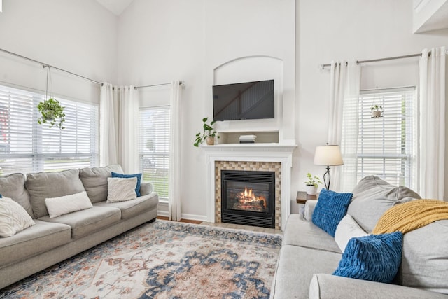 1443 Bern Dr, Spring Hill, TN 37174 - living area with a glass covered fireplace and a towering ceiling