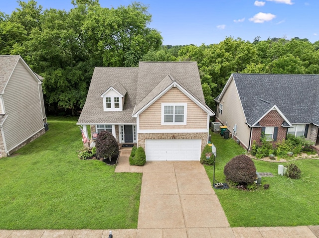 1443 Bern Dr, Spring Hill, TN 37174 - view of front of property with concrete driveway, a garage, and a front lawn