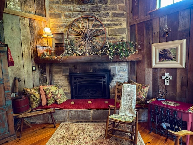 4929 Snow Creek Rd, Santa Fe, TN 38482 - sitting room featuring wood walls, wood finished floors, and a fireplace