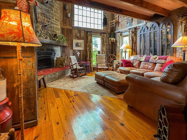 4929 Snow Creek Rd, Santa Fe, TN 38482 - living area featuring hardwood / wood-style floors, a large fireplace, beam ceiling, and a towering ceiling