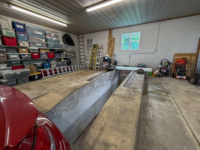 4929 Snow Creek Rd, Santa Fe, TN 38482 - garage featuring concrete block wall
