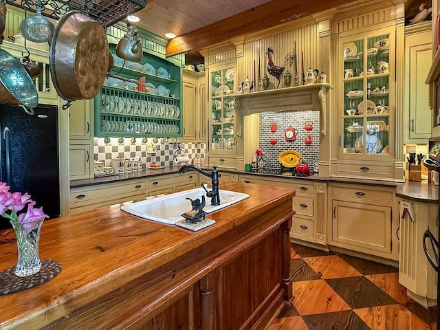 4929 Snow Creek Rd, Santa Fe, TN 38482 - bar area featuring freestanding refrigerator, tasteful backsplash, and stainless steel gas cooktop