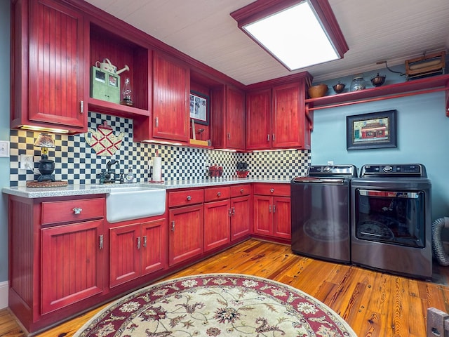 4929 Snow Creek Rd, Santa Fe, TN 38482 - laundry area featuring independent washer and dryer, cabinet space, and light wood-style flooring