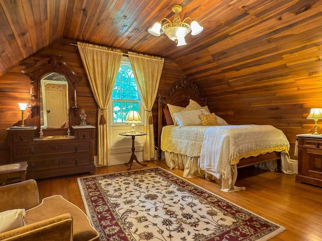 4929 Snow Creek Rd, Santa Fe, TN 38482 - bedroom featuring wood walls, vaulted ceiling, a chandelier, wood finished floors, and wooden ceiling