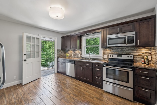 1338 Ardee Ave, Nashville, TN 37216 - kitchen featuring stainless steel appliances, plenty of natural light, dark brown cabinetry, and backsplash