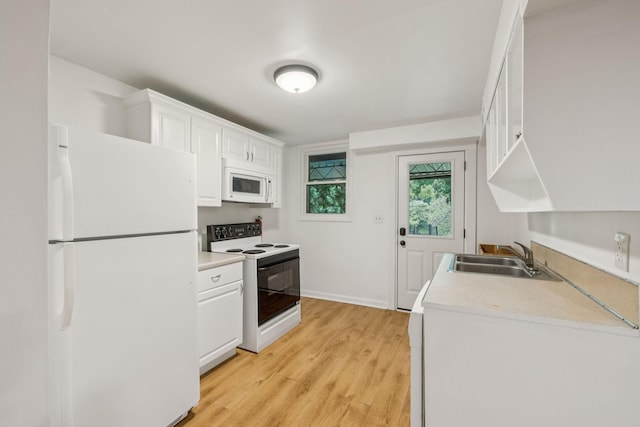 1338 Ardee Ave, Nashville, TN 37216 - kitchen with white appliances, light wood-style floors, white cabinets, and light countertops