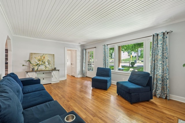 1338 Ardee Ave, Nashville, TN 37216 - living room featuring ornamental molding, light wood-type flooring, and arched walkways