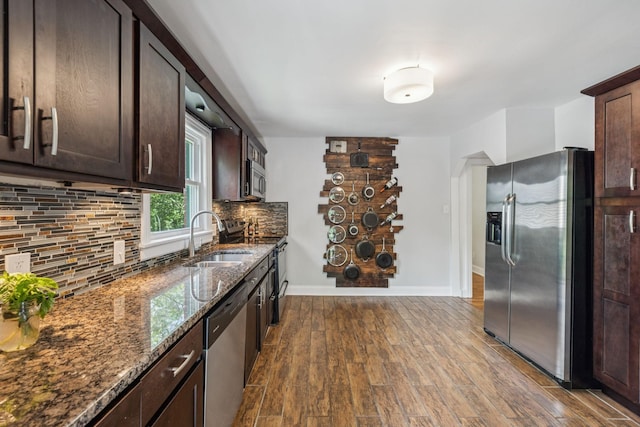 1338 Ardee Ave, Nashville, TN 37216 - kitchen featuring stainless steel appliances, dark brown cabinets, dark stone countertops, and dark wood-style flooring