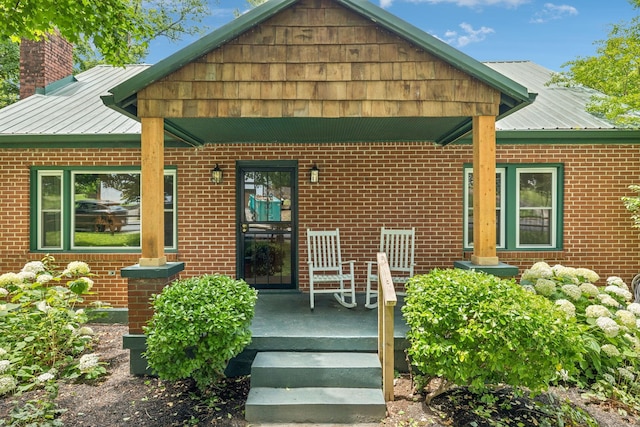 1338 Ardee Ave, Nashville, TN 37216 - property entrance with brick siding, a chimney, and a metal roof