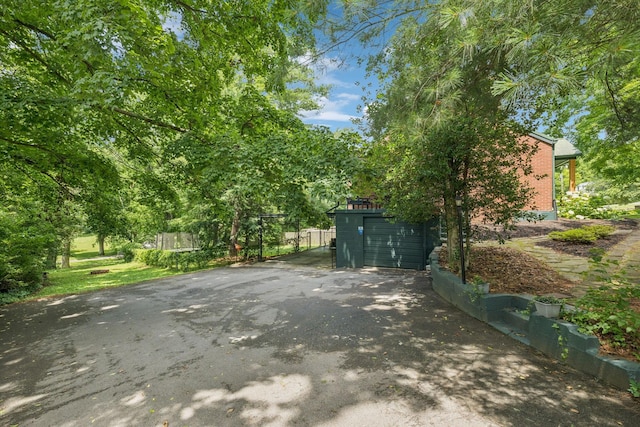 1338 Ardee Ave, Nashville, TN 37216 - view of patio with asphalt driveway and a garage