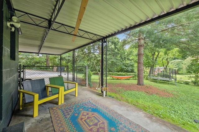 1338 Ardee Ave, Nashville, TN 37216 - view of patio featuring a trampoline, a gate, and view of wooded area