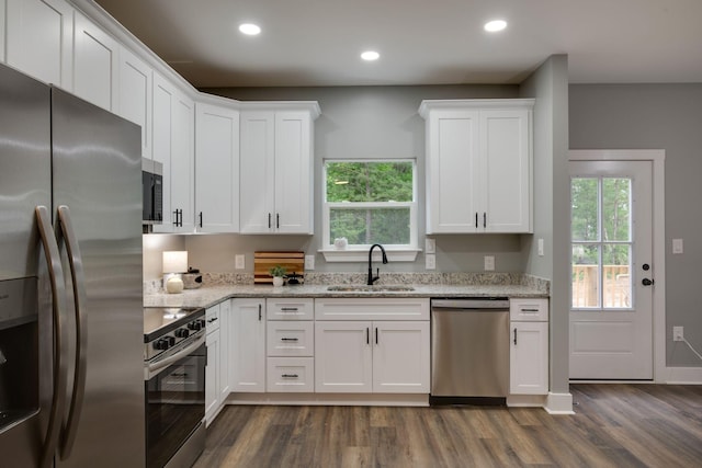 85 Truform Way, Dickson, TN 37055 - kitchen with appliances with stainless steel finishes, dark wood finished floors, white cabinets, plenty of natural light, and recessed lighting