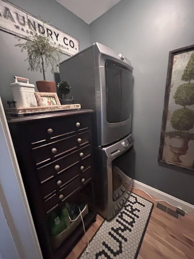 207 Walnut St, Springfield, TN 37172 - washroom with stacked washer / drying machine and light wood-style floors
