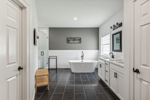 5077 Joe Peay Rd, Spring Hill, TN 37174 - full bath with a freestanding tub, double vanity, a stall shower, recessed lighting, and tile patterned floors