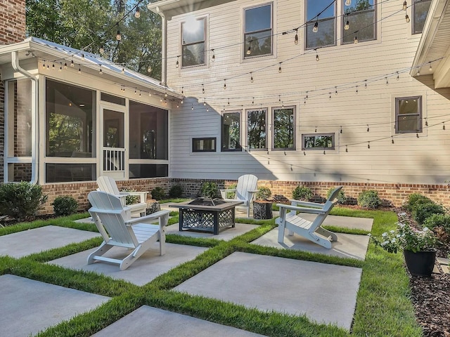 2001 Trilogy Ln, Mount Pleasant, TN 38474 - view of patio / terrace featuring a fire pit and a sunroom