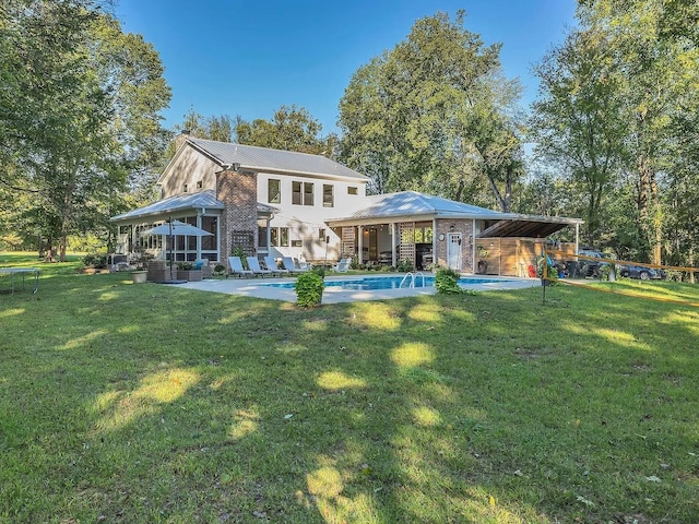 2001 Trilogy Ln, Mount Pleasant, TN 38474 - back of property featuring an outdoor pool, a lawn, a metal roof, and a patio area