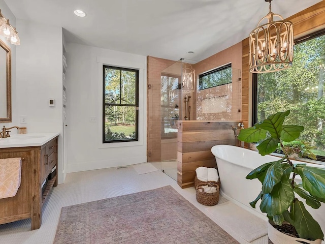 2001 Trilogy Ln, Mount Pleasant, TN 38474 - full bathroom with a chandelier, vanity, a stall shower, a freestanding bath, and recessed lighting