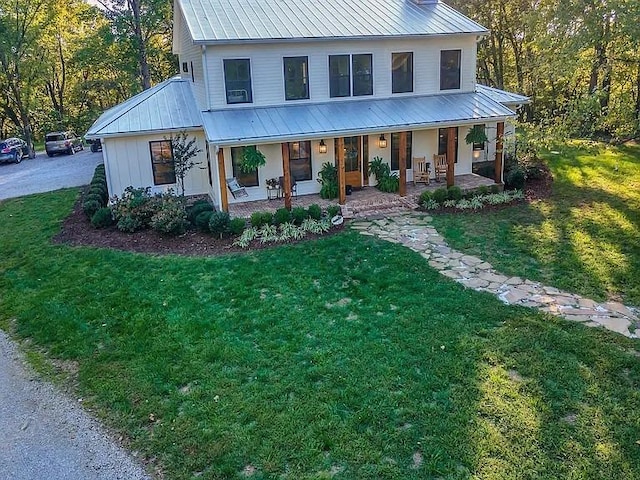 2001 Trilogy Ln, Mount Pleasant, TN 38474 - view of front of property featuring covered porch, a front lawn, and a metal roof