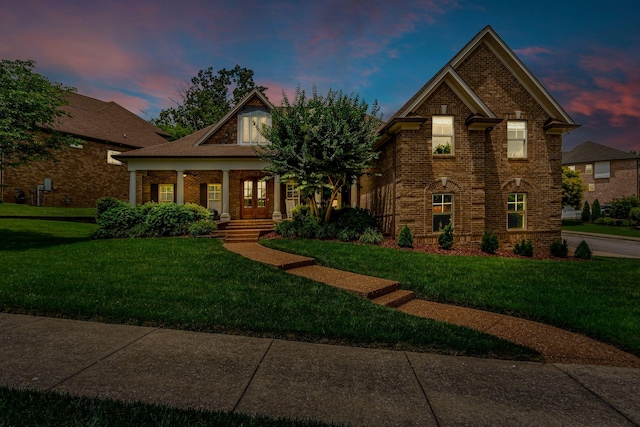 1051 Fitzroy Cir, Spring Hill, TN 37174 - view of front of property with covered porch, a yard, and brick siding