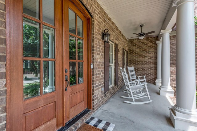 1051 Fitzroy Cir, Spring Hill, TN 37174 - property entrance with covered porch, a ceiling fan, brick siding, and french doors