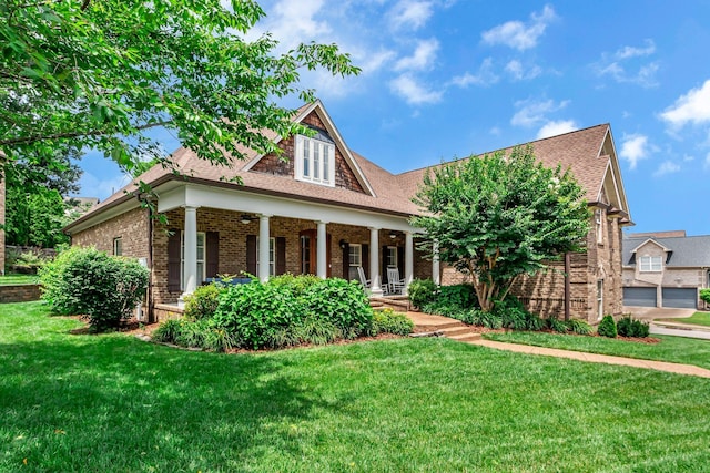 1051 Fitzroy Cir, Spring Hill, TN 37174 - view of front of house with brick siding, a porch, a front yard, and roof with shingles
