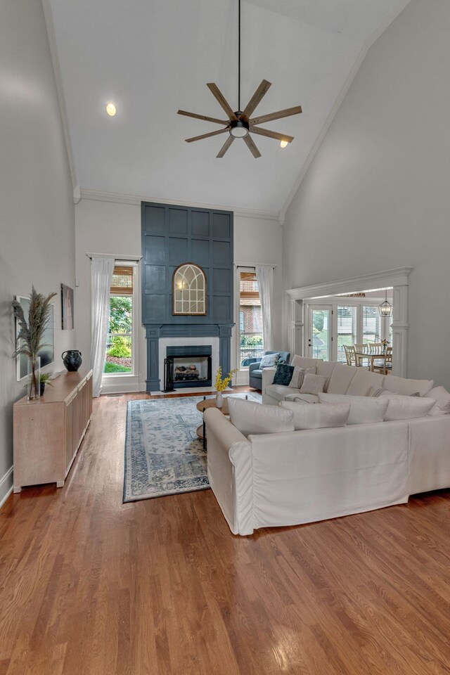 1051 Fitzroy Cir, Spring Hill, TN 37174 - living area with ceiling fan, high vaulted ceiling, ornamental molding, a large fireplace, and wood finished floors