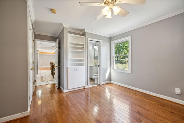 519 Hemingway Dr, Columbia, TN 38401 - unfurnished bedroom featuring wood-type flooring, ornamental molding, ensuite bath, and a ceiling fan