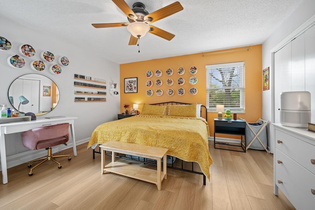 1509 Pointer Ct, Antioch, TN 37013 - bedroom featuring light wood finished floors, a closet, ceiling fan, and a textured ceiling