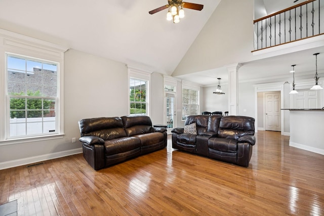 3002 Stow Xing, Murfreesboro, TN 37128 - living room featuring light wood finished floors, a ceiling fan, high vaulted ceiling, ornate columns, and crown molding