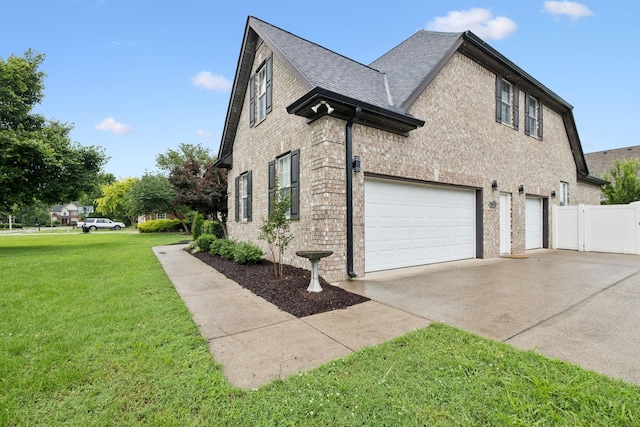 3002 Stow Xing, Murfreesboro, TN 37128 - view of side of home with concrete driveway, an attached garage, a shingled roof, and brick siding