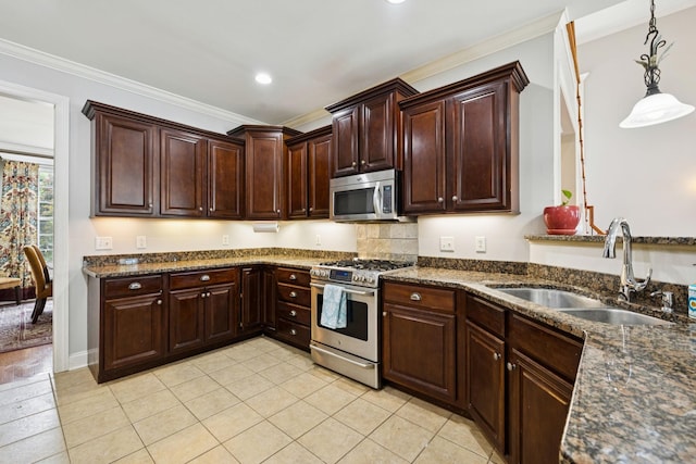3002 Stow Xing, Murfreesboro, TN 37128 - kitchen with appliances with stainless steel finishes, ornamental molding, hanging light fixtures, dark stone counters, and dark brown cabinetry