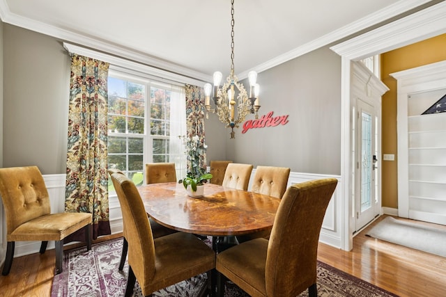 3002 Stow Xing, Murfreesboro, TN 37128 - dining space with wood finished floors, a chandelier, and ornamental molding