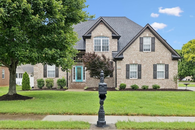 3002 Stow Xing, Murfreesboro, TN 37128 - view of front facade with a front yard, brick siding, and a shingled roof