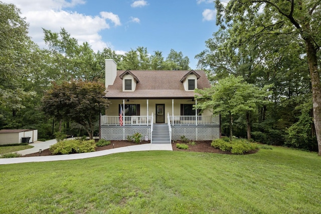 4457 Tanglewood Rd, Pegram, TN 37143 - cape cod-style house featuring a porch, a front yard, a chimney, and a ceiling fan