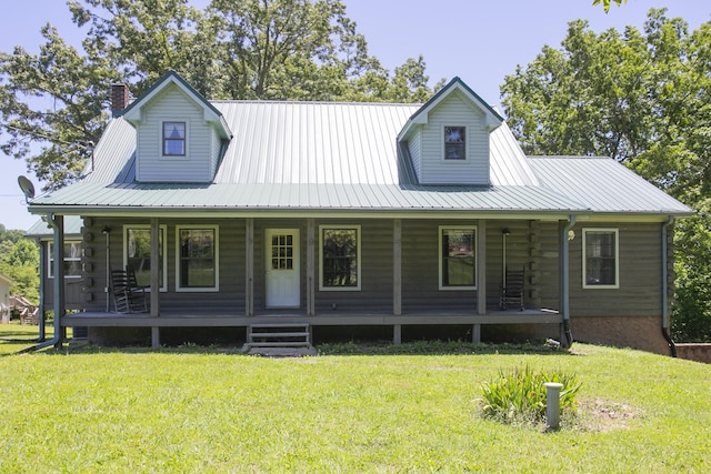 1530 Roy Brown Rd, Burns, TN 37029 - farmhouse featuring a porch, a front lawn, a chimney, and log siding