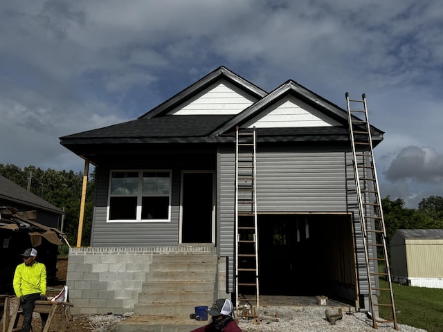 130 Alabama Ave, Oak Grove, KY 42262 - view of front of house with a garage, roof with shingles, and a shed