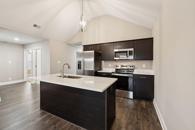 130 Alabama Ave, Oak Grove, KY 42262 - kitchen featuring appliances with stainless steel finishes, light countertops, a kitchen island with sink, dark wood-type flooring, and high vaulted ceiling